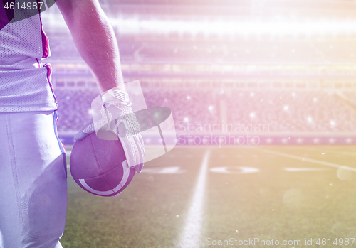 Image of closeup American Football Player isolated on big modern stadium