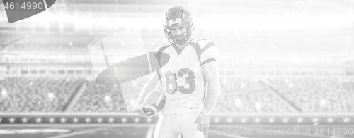 Image of American Football Player isolated on big modern stadium field