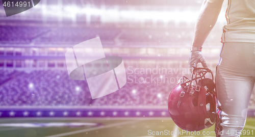 Image of closeup American Football Player isolated on big modern stadium