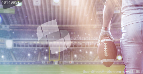 Image of closeup American Football Player isolated on big modern stadium