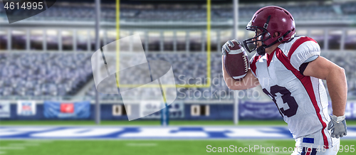 Image of American football Player running with the ball