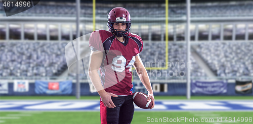 Image of American Football Player isolated on big modern stadium field