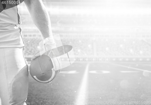 Image of closeup American Football Player isolated on big modern stadium