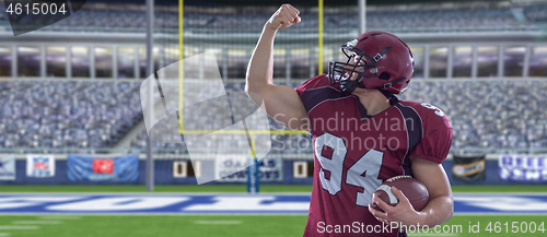 Image of american football player celebrating touchdown