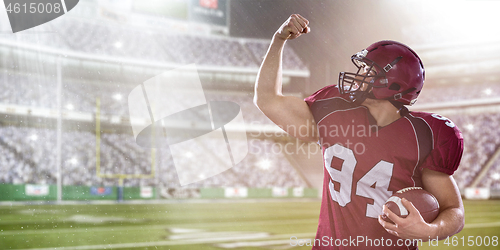 Image of american football player celebrating touchdown