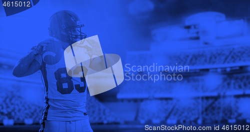 Image of duo toned american football player in  arena at night