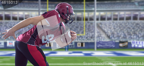 Image of American football Player running with the ball