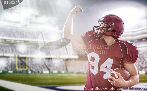 Image of american football player celebrating touchdown