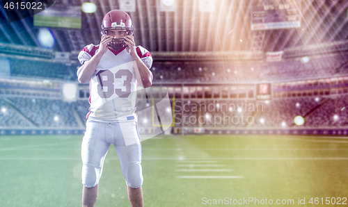 Image of American Football Player isolated on big modern stadium field