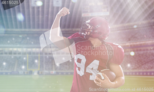 Image of american football player celebrating touchdown