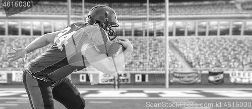 Image of American football Player running with the ball