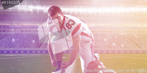 Image of American Football Player on big modern stadium field