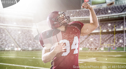 Image of american football player celebrating touchdown