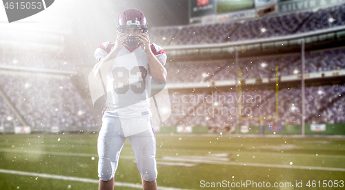 Image of American Football Player isolated on big modern stadium field