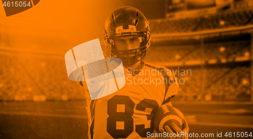 Image of duo toned american football player in  arena at night