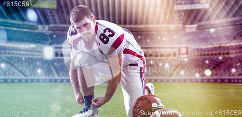 Image of American Football Player on big modern stadium field