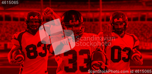 Image of duo toned american football player in  arena at night