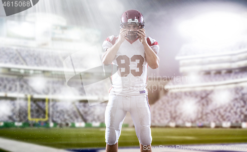 Image of American Football Player isolated on big modern stadium field