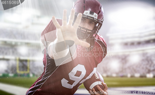 Image of portrait of confident American football player