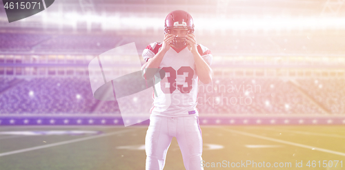 Image of American Football Player isolated on big modern stadium field