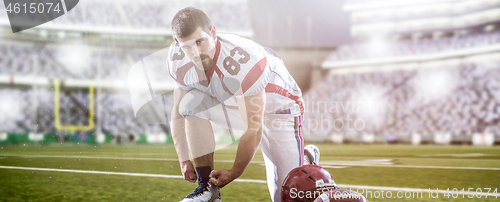 Image of American Football Player on big modern stadium field