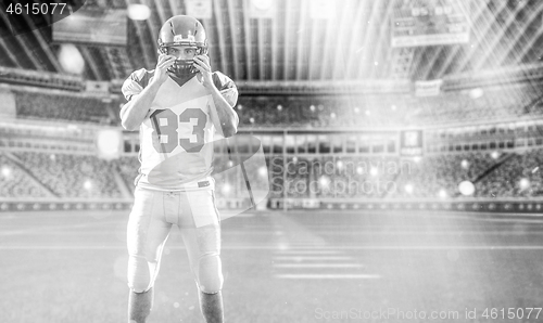 Image of American Football Player isolated on big modern stadium field