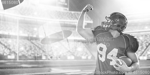 Image of american football player celebrating touchdown