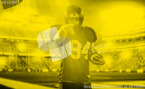 Image of duo toned american football player in  arena at night