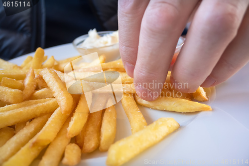 Image of Grabbing some French fries
