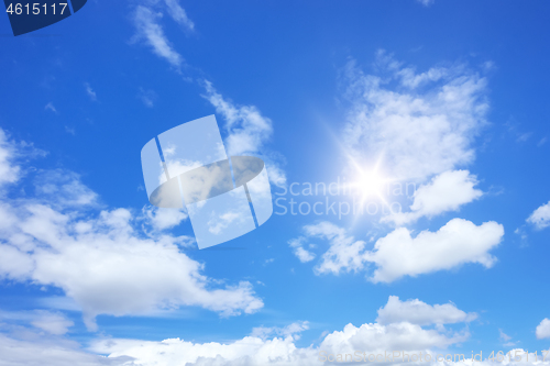 Image of blue sky sun and clouds background