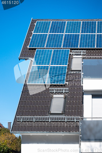 Image of some solar panels on the roof of a private house