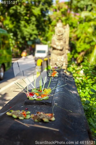 Image of Votive offering with flowers, cookies and ribbons