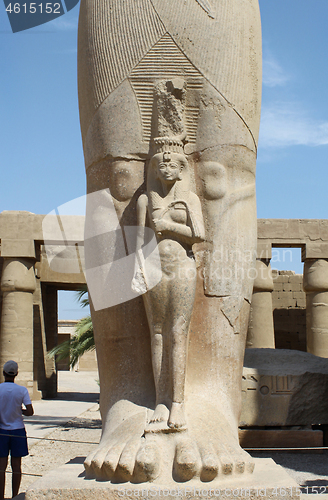 Image of Detail of egyptian statue of Pharaoh Ramses II with small statue