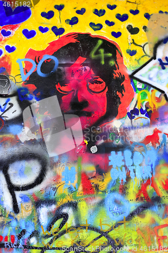 Image of Detail of bright colorful John Lennon's wall with graffiti in Pr