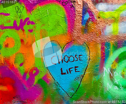 Image of Detail of bright colorful John Lennon's wall with graffiti in Pr