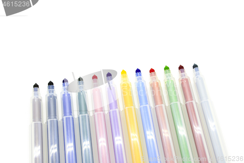 Image of Open multicolored markers on a white background