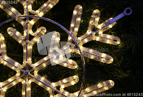 Image of Close-up of bright glowing led christmas snowflake