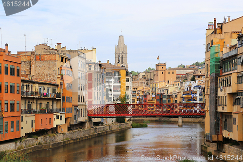 Image of Colorful houses and Eiffel bridge on river Onyar in Girona