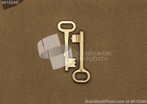 Image of Two old metal keys on paper background