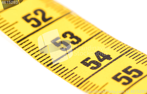 Image of Close-up of a yellow measuring tape isolated on white - 54