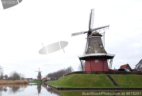 Image of Dokkum, the Netherlands on December 26, 2019: Canal and windmill