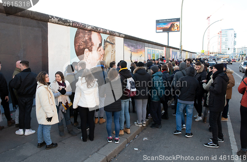 Image of Berlin, Germany on Januari 1, 2020: Tourists in front of a kissi