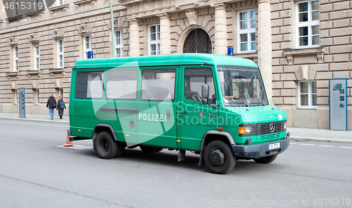 Image of BERLIN, GERMANY - DECEMBER 30, 2019: Empty green police van park
