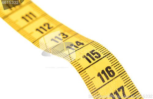 Image of Close-up of a yellow measuring tape isolated on white - 115