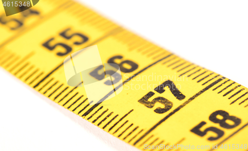 Image of Close-up of a yellow measuring tape isolated on white - 57