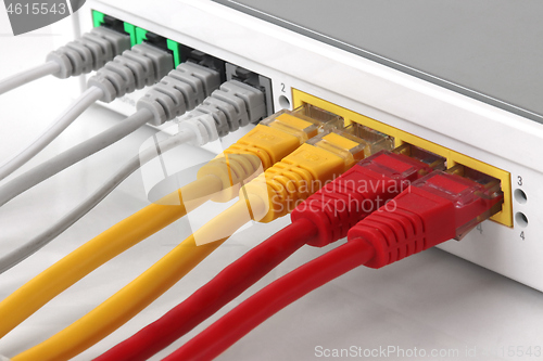 Image of Wireless Modem router with ethernet network hub with cables conn