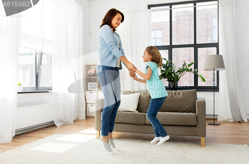 Image of mother and daughter having fun at home