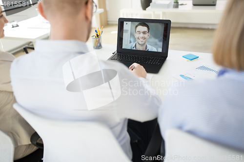 Image of business team having video conference at office