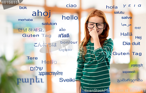 Image of smiling red haired student girl in glasses