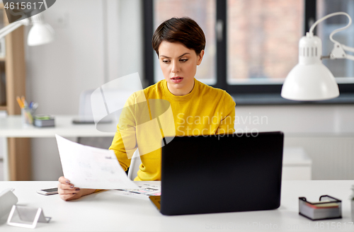 Image of creative woman working on user interface at office